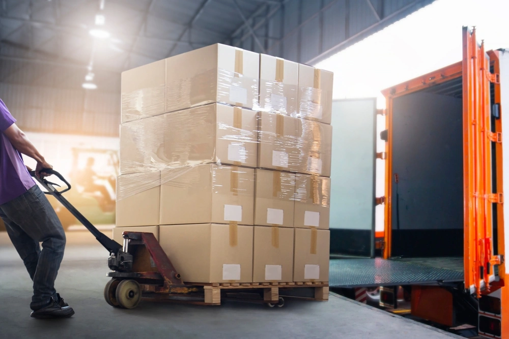 unloading a pallet from a truck at the loading dock