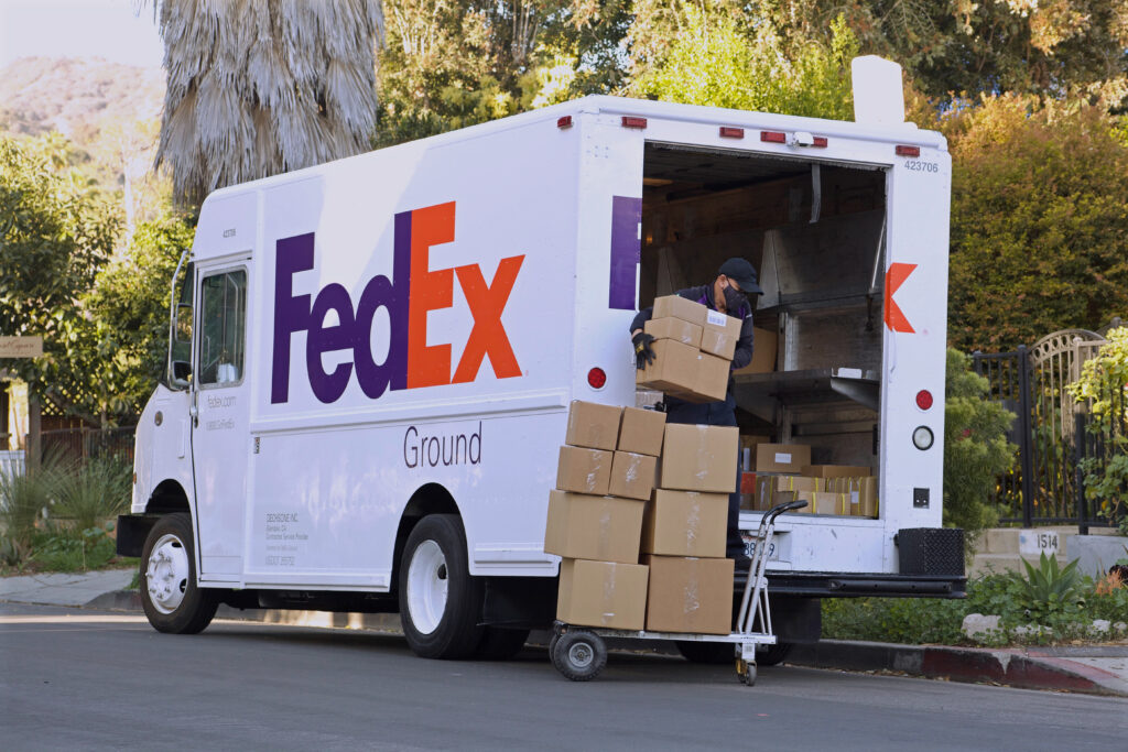 FedEx driver delivering packages