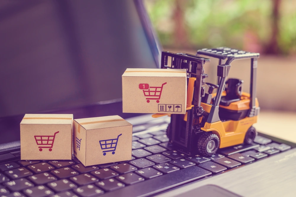 keyboard with a mini forklift and boxes on top