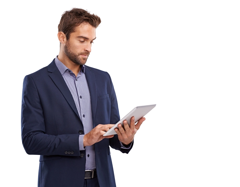 man in a suit looking at a tablet