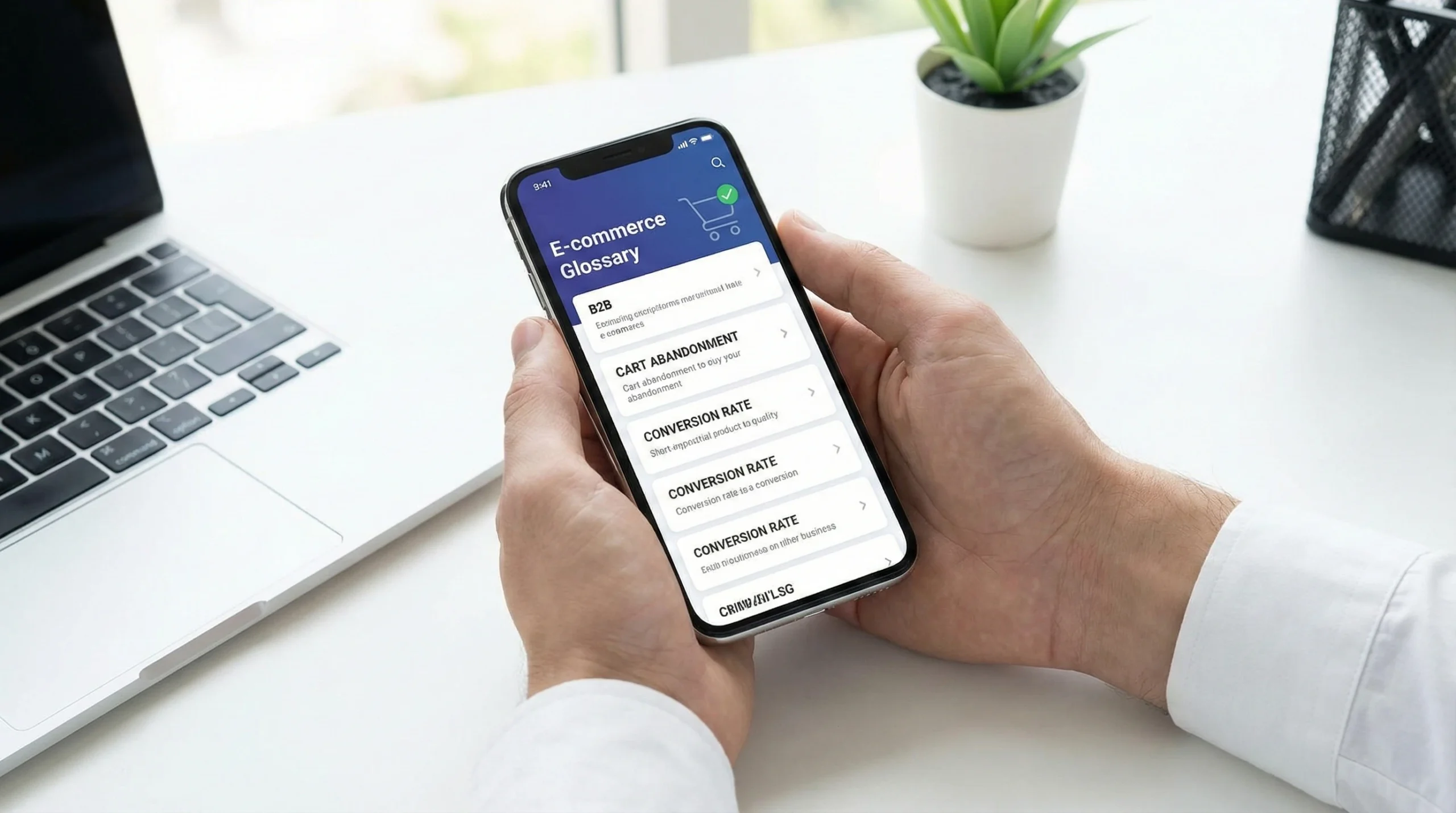 hands and mobile phone for ecommerce glossary