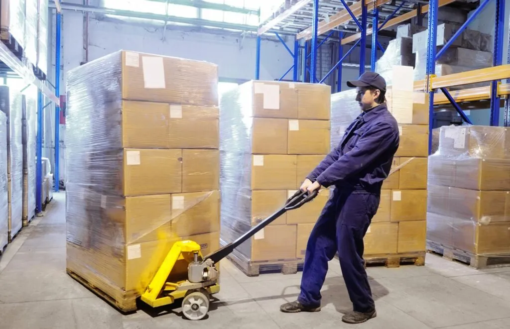 moving a shrink-wrapped pallet in a warehouse